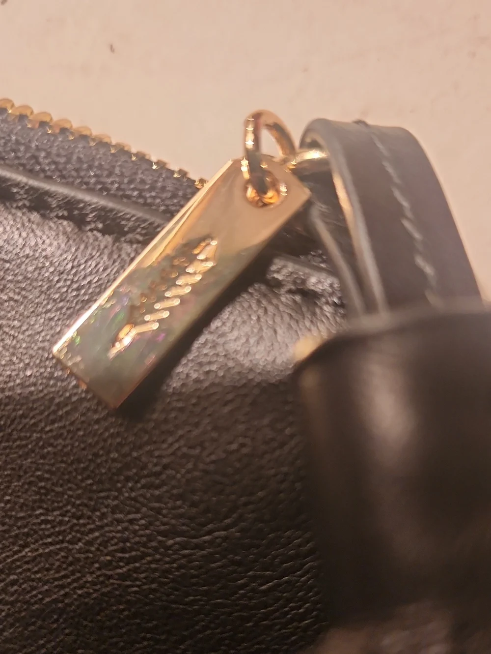 Thacker Black Leather Wristlet Clutch with Gold Ring Handle